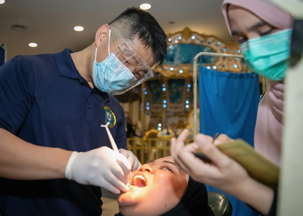 Dentist examining a patient's teeth