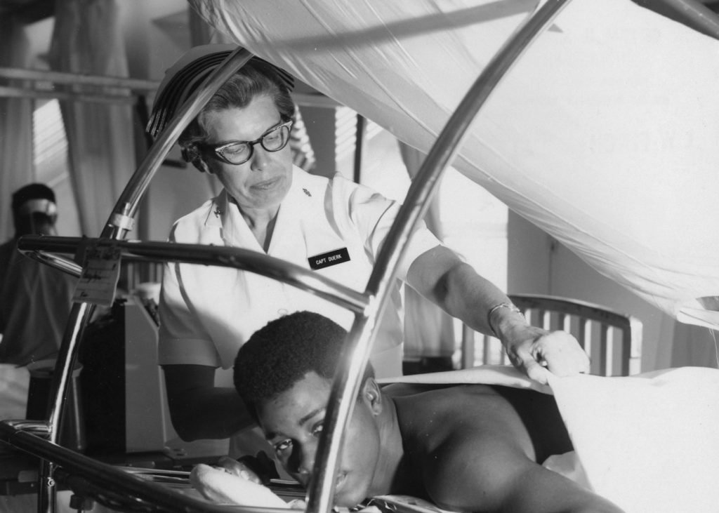 Nurse attending to a patient